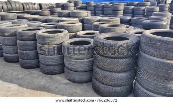 stacks of old used tires for sale at \
store. Second hand car tires.stack of old\
tires.