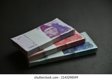 Stacks Of Pakistan Rupee In Different Denominations. Currency War Concept, Falling Rupee Value In Pakistan Against US Dollar. Shallow Depth Of Field. Selective Focus.