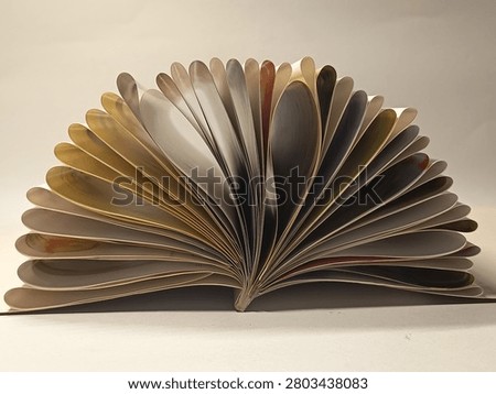 The stacks of paper form a semicircle