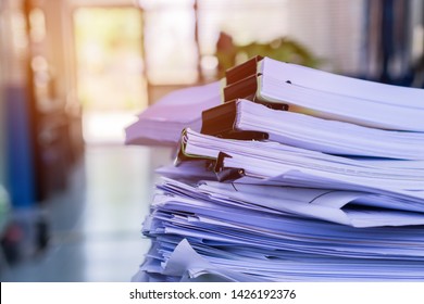 Stacks Of Piles Unfinished Papers Documents Files In Accounting Business Report With Black Clips Paper Corner On Desk In Busy Office, Paperwork Of Financial Folder At Business Workplace Concept