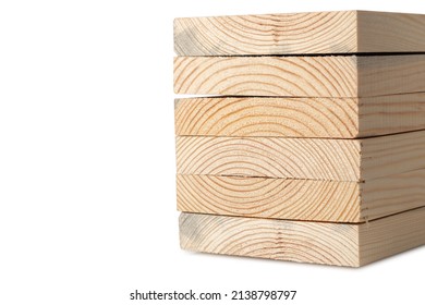 Stacks of pine wood planks on white. Natural rough wooden boards boards, lumber, industrial wood, timber.