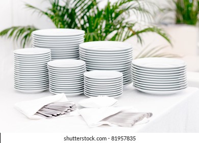 Stacks of plates for a buffet/ Stacks of plates