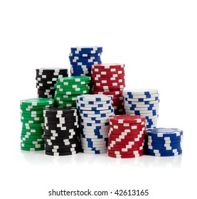 Stacks Of Poker Chips Including Red, Black, White, Green And Blue On A White Background