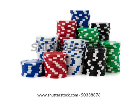Stacks of poker chips including red, black, white, green and blue on a white background