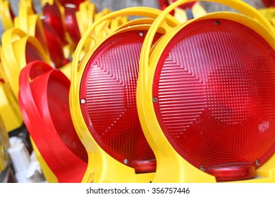 Stacks of red and yellow warning construction barrier signs, Germany.