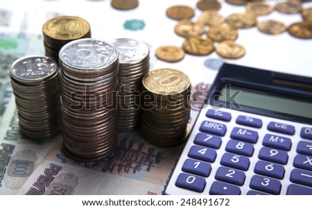 stacks of Russian rubles with calculator close up