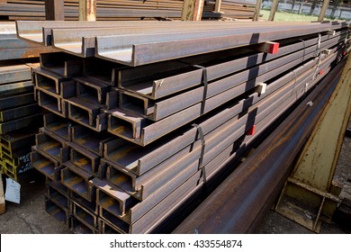 Stacks of stainless steel bars and rails in an iron deposit