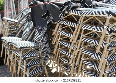 Stacks Of Striped Chairs For Outdoor Restaurant Seating