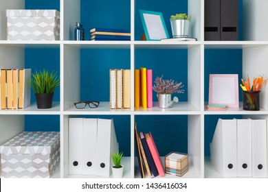 Stacks of supplies and paperwork in the office and bookshelves - Shutterstock ID 1436416034