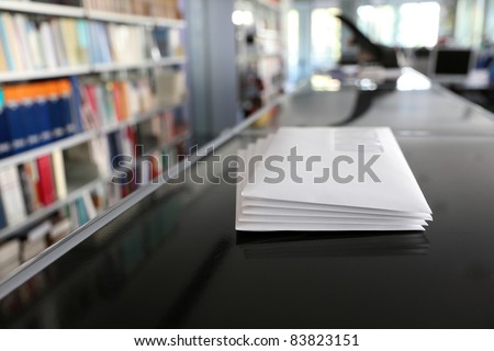 Stacks of white mail envelopes in office