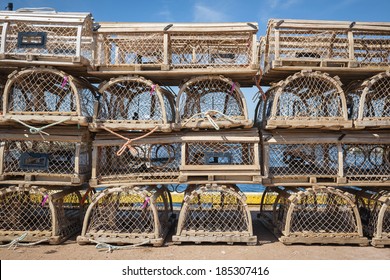 Stacks of wooden lobster traps on pier in North Rustico, Prince Edward Island, Canada.