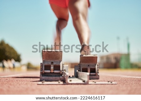 Stadium, back view and runner on start blocks for sprint, race or competition outdoors. Sports, woman or black female sprinter running with energy, speed or strength for fitness, training or marathon