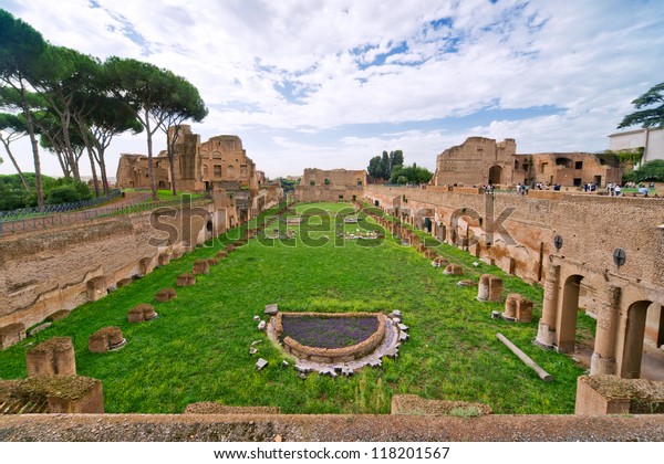 Stadium of Domitian on Palatine Hill, Rome,\
Italy. Palatine is tourist attraction of Rome. Panorama of Ancient\
Roman ruins in Roma city center in summer. Landscape of Palatine\
with old landmark.