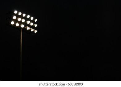 Stadium Flood Lights On A Sports Field At Night With Copy Space