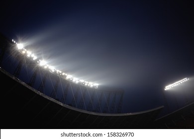Stadium floodlights at night time