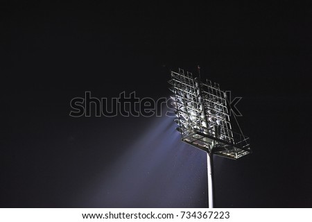 stadium lights against dark night sky background
