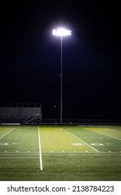 Stadium Lights On A Poll Next To American Football High School Field