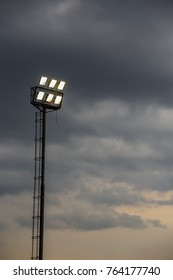 Stadium Lights On A Stormy Evening. Flood Lights On A Cloudy Afternoon. Lighting The Way