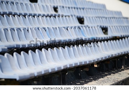Stadium. A Old blue seats.