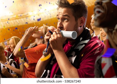 Stadium Soccer Fans Emotions Portrait In Yellow Toning