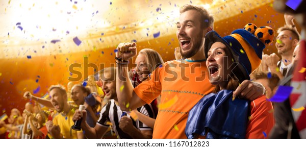 stadium\
soccer fans emotions portrait in yellow\
toning