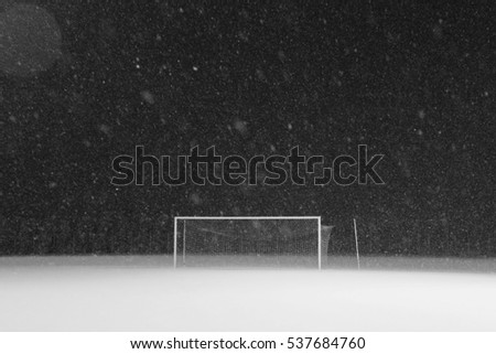 Stadium under the night snow raining