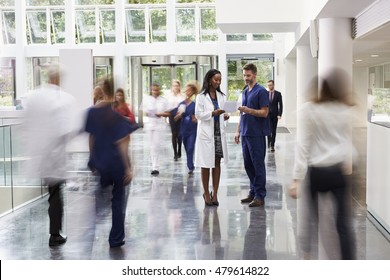 Staff In Busy Lobby Area Of Modern Hospital - Shutterstock ID 479614822