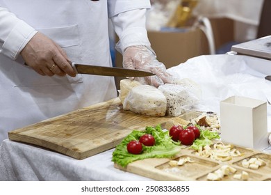 Staff cutting cheese at counter in market. Food - Powered by Shutterstock