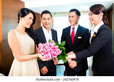 Staff Greeting Guests In Hotel