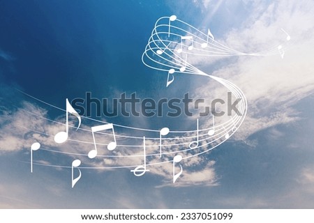 Staff with musical notes on blue sky