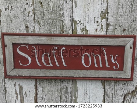 Staff Only Sign on Aged Fence