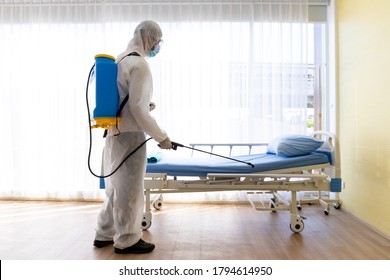 Staff Protective Suit PPE And Mask.Cleaning And Disinfection In A Room Of Hospital Amid The Coronavirus Epidemic Professional Teams For Disinfection Efforts Infection Prevention Control Of Epidemic.