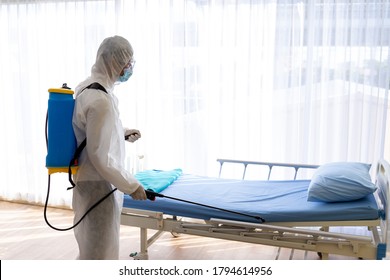 Staff Protective Suit PPE And Mask.Cleaning And Disinfection In A Room Of Hospital Amid The Coronavirus Epidemic Professional Teams For Disinfection Efforts Infection Prevention Control Of Epidemic.