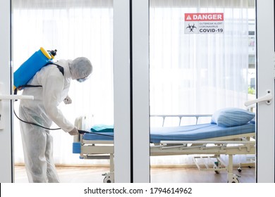 Staff Protective Suit PPE And Mask.Cleaning And Disinfection In A Room Of Hospital Amid The Coronavirus Epidemic Professional Teams For Disinfection Efforts Infection Prevention Control Of Epidemic.