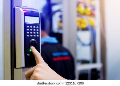 Staff push down electronic control machine with finger scan to access the door of control room or data center. The concept of data security or data access control.
