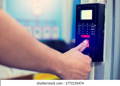 Staff push down electronic control machine with finger scan to access the door of control room or data center. The concept of data security or data access control.