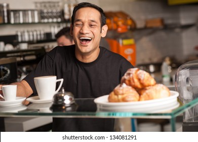 A Staff At Restaurant Bursts Out With Laughter For A Joke Cracked By Customer.