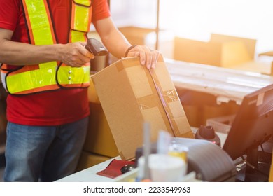 staff worker check postal label with laser barcode scanner at products box for shipping delivery to online order customer. - Powered by Shutterstock