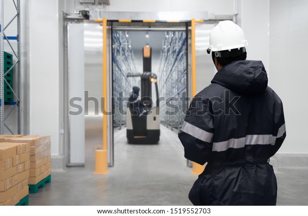 Staff worker\
control in freezing room or\
warehouse