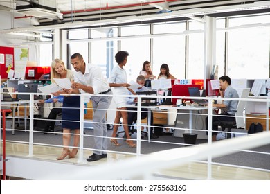 Staff Working In A Busy Office Mezzanine