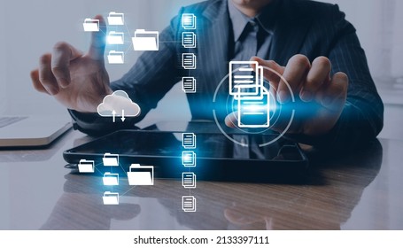 IT staff working with Document Management System (DMS), online documentation database and process automation to efficiently manage files, Corporate business technology.