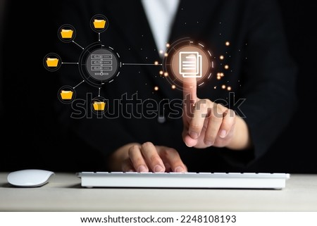 IT staff working with Document Management System (DMS), online documentation database and process automation to efficiently manage files, Corporate business technology.