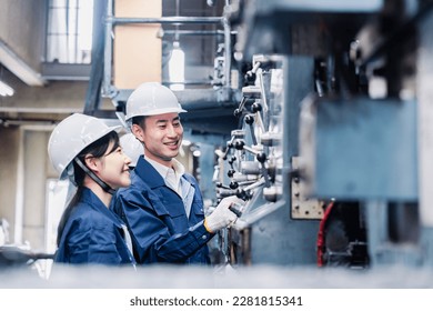 Staff working at a power plant - Powered by Shutterstock