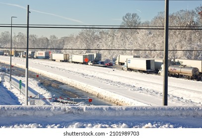 Stafford, VA USA - January 4 2022 : Vehicles Stuck in a Traffic Jam After a Winter Snow Storm with Snow Covered Roads