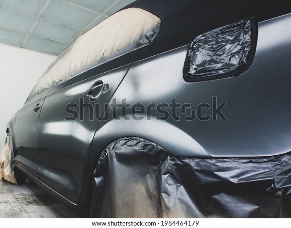 Stage\
of application of car paint.Car repair\
technology