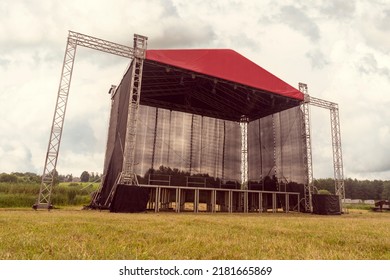 Stage For Concert Or Show On The City Park. Metal Frame Construction For Light, Sound And Video Equipment . No People At Day Time.