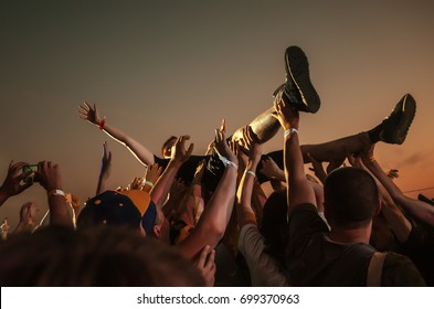 Stage Diving. Crowd Surfing During A Musical Performance