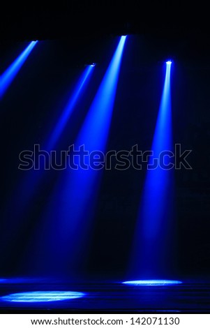 stage lighting effect in the darkness, closeup of photo