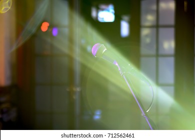 Stage microphone in the rays of light