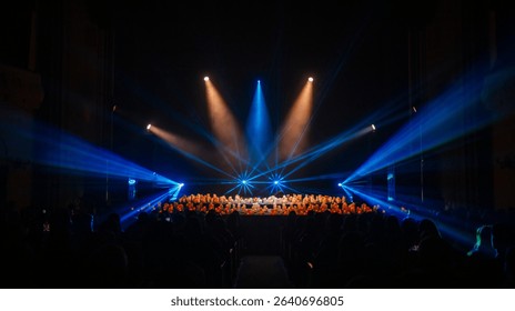 Stage Performance with Audience and Dynamic Lighting